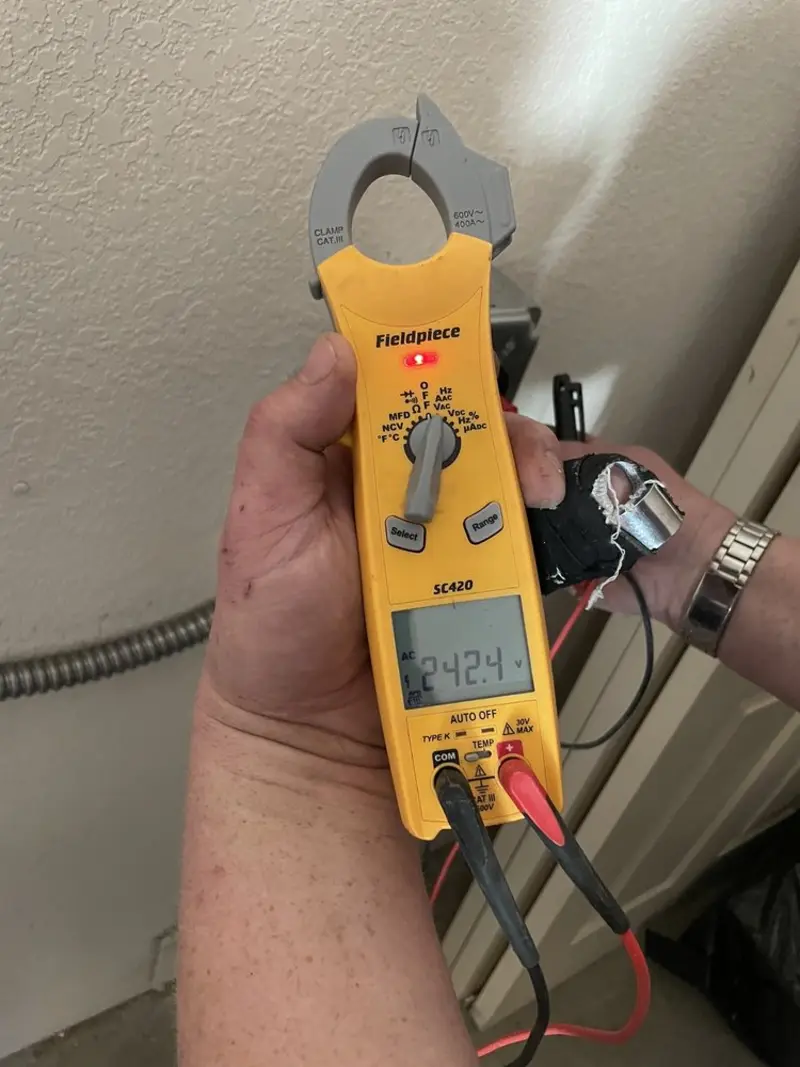 Voltage testing with clamp meter during Outlet Installation in Cornwall